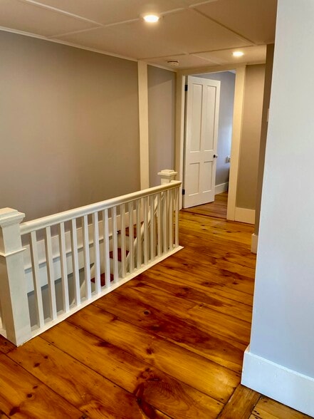 The first of two bedrooms is located on the second floor at the top of the stairs. - 20 Chapel St