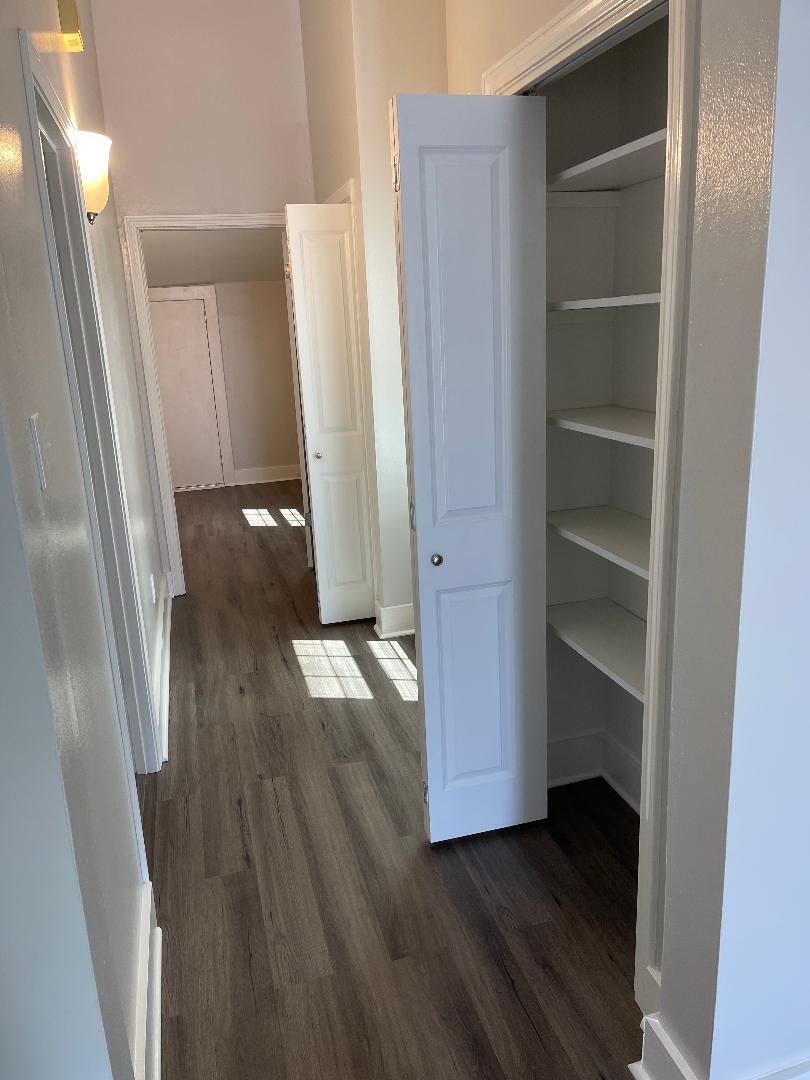 Hall with bathroom on left 2 closets - 739 Valence St
