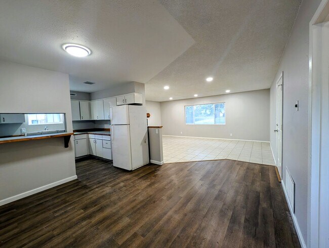 Building Photo - 4-bedroom house with a 2-car garage availa...