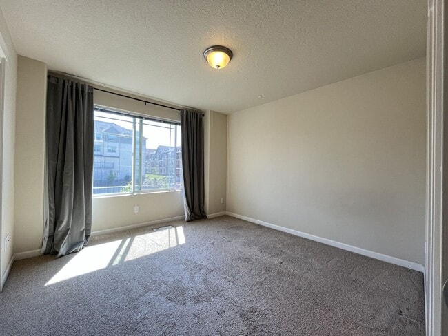 Building Photo - Spacious Bull Mountain Townhome Featuring Two Ensuite Bedrooms, Attached Garage & Modern Finishes &