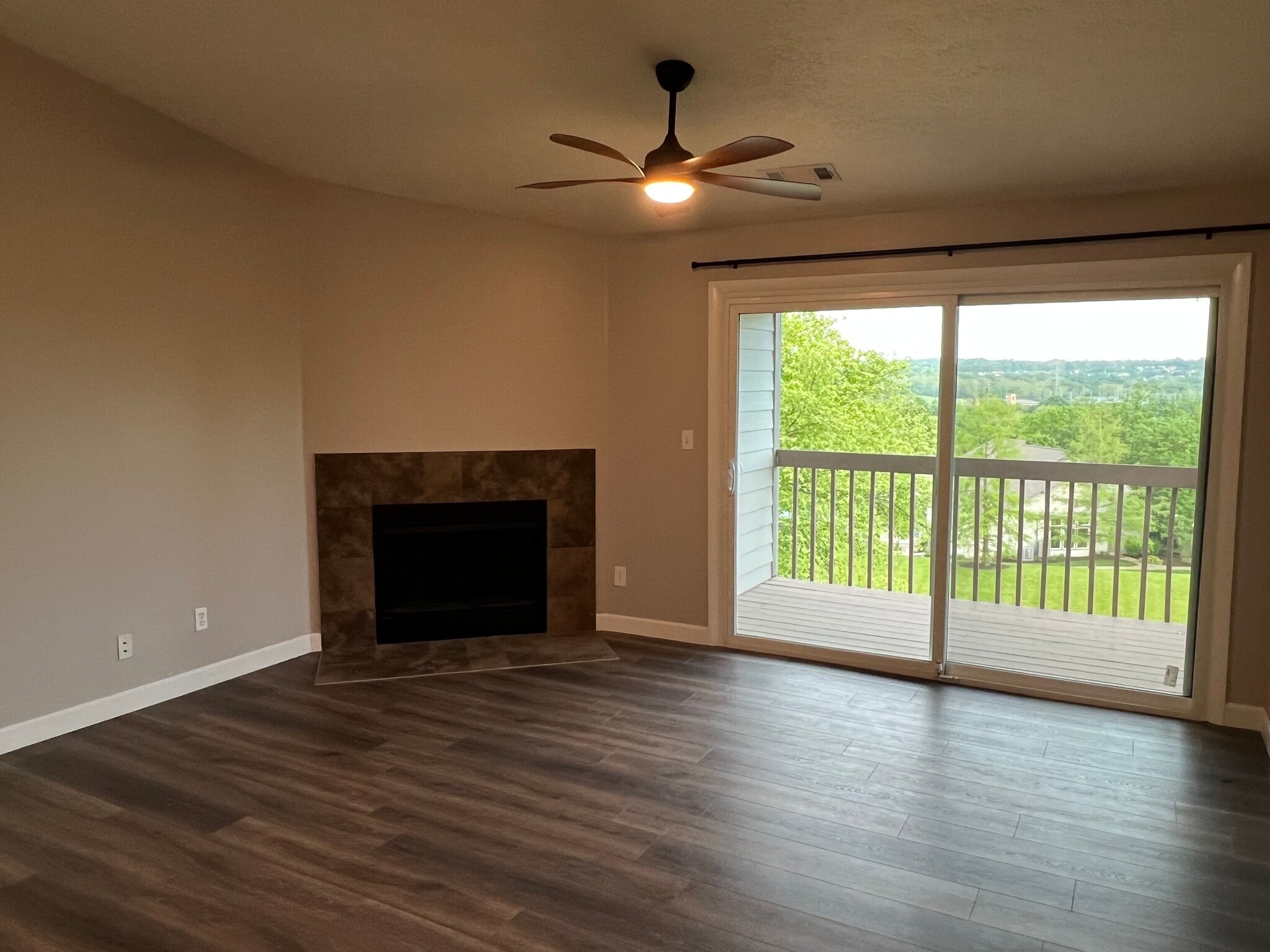 Living Room with Balcony View - 8892 Eagleview Dr