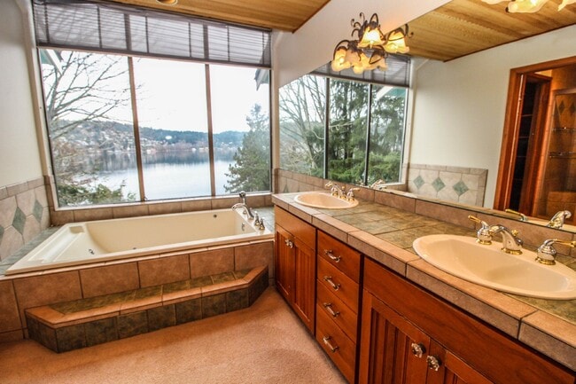 Building Photo - Spacious 4-Bedroom Home with Stunning Lake...
