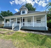 Building Photo - Welcome to this stunning 4-bedroom, 2-bath...
