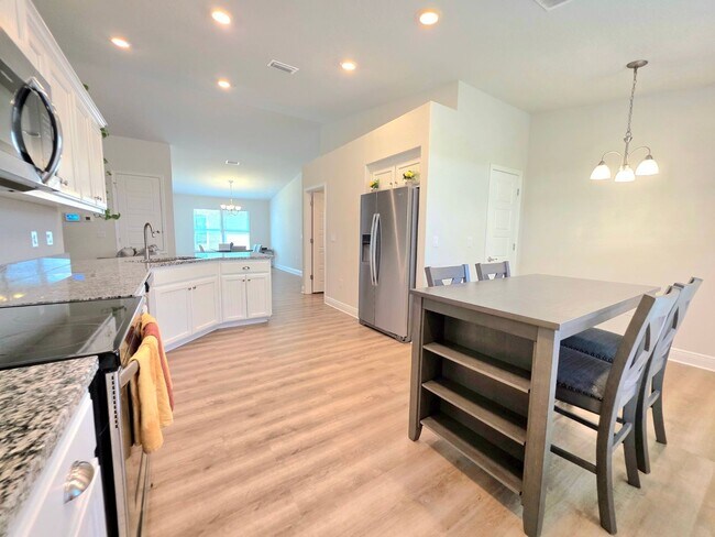 Building Photo - Spacious 4BR Home Near Navy Federal & UWF ...
