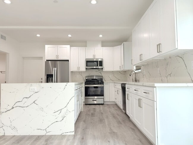 Building Photo - Chic Modern Living in Panorama City – 4 Be...