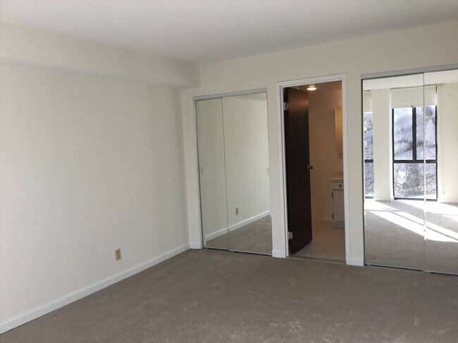 Primary Bedroom with two big closets with sliding mirror doors & ensuite bathroom - 1401 N Rhodes St