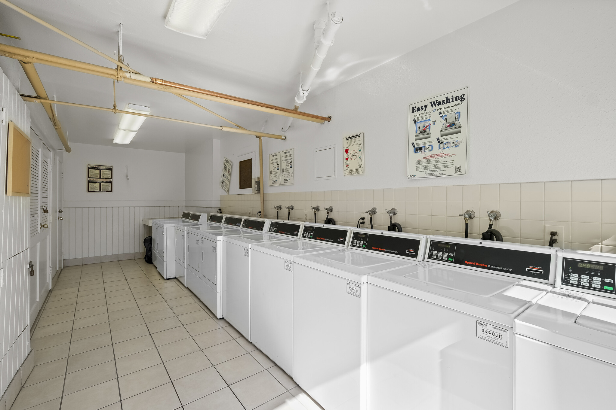 Convenience meets cleanliness in our shared laundry room. - 4110 Mount Alifan Pl