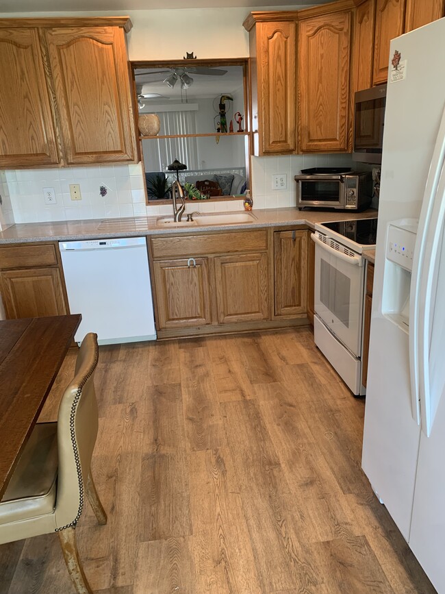 Kitchen with view of the water. - 10309 Waterbird Way