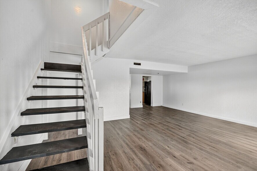 stairs front living room - 1405 White Pine Dr