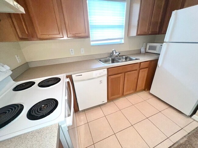 Building Photo - MOVE IN NOW-Water & electricity included 1x1 above garage apartment!! Full kitchen & bathroom!! W...