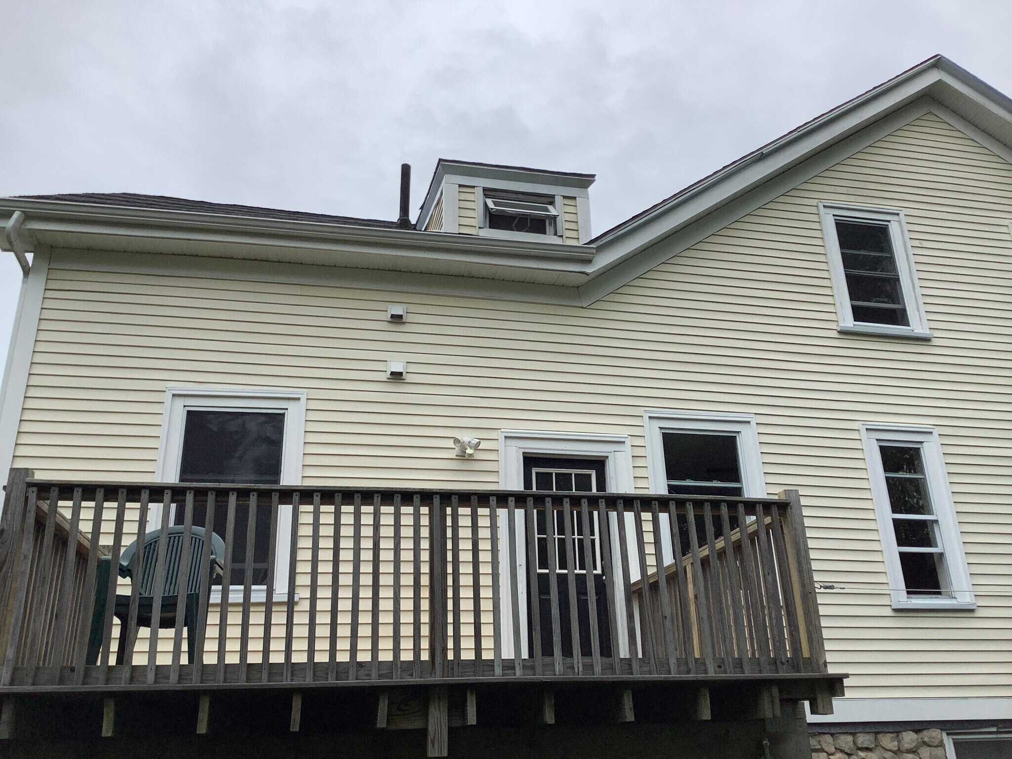 The back deck off the kitchen measures 10’ by 14’. - 9 Jay St