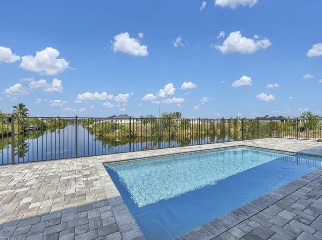 Building Photo - Almost New Construction Waterfront Home in NE Cape Featuring A Pool, Fenced Yard & More! COMING SOON