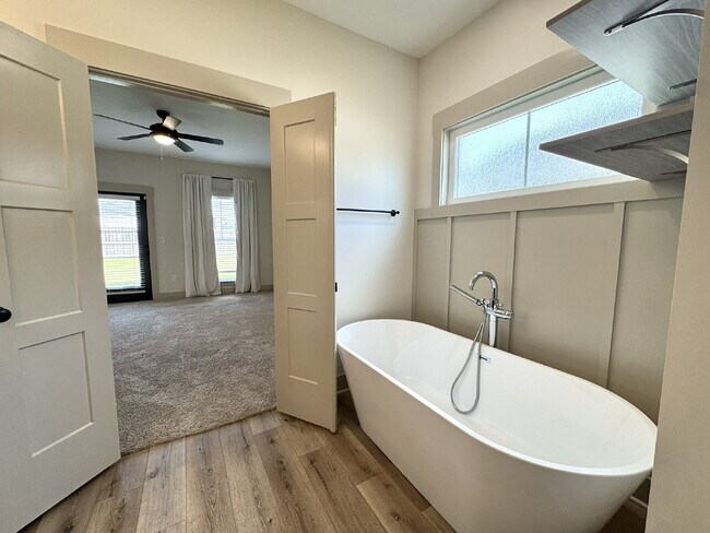 Building Photo - Need Space?  How about 5 bedrooms, 2.5 baths + an extra bonus area upstairs so that the kids can ...