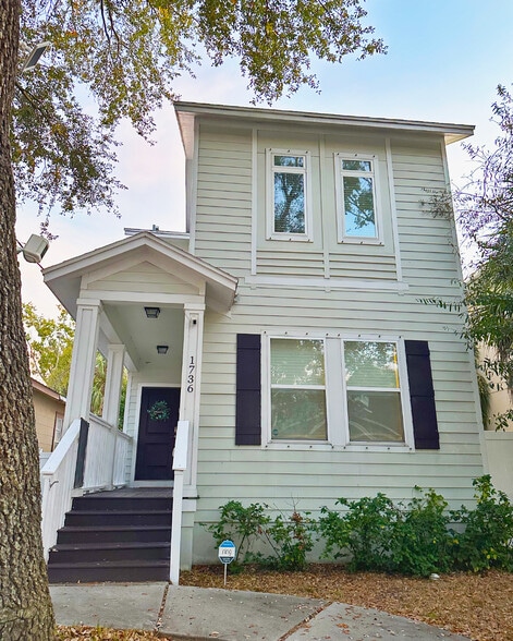 Additional image of front exterior of home featuring security system. - 1736 W Walnut St
