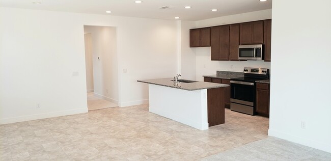 Building Photo - The 2 YEARS NEW 4 bedroom + 3 car garage r...