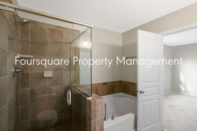 Building Photo - Charming Townhome with Open Layout, Back Patio & One-Car Garage – Near RTP, RDU & Everyday Conven...