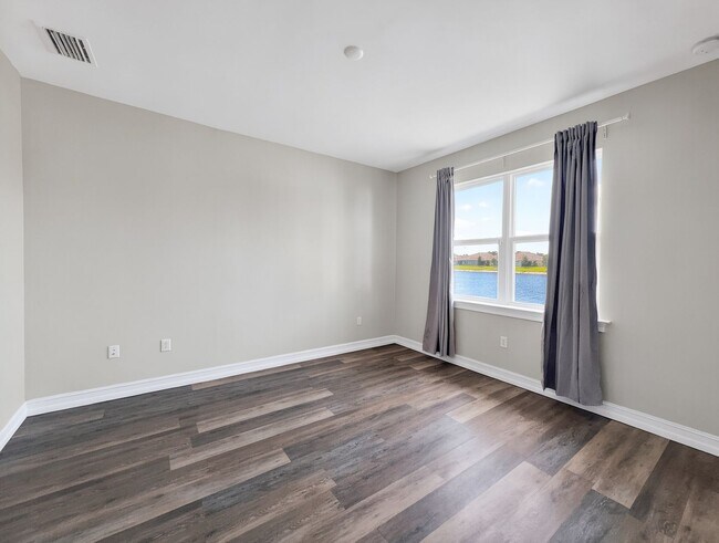 Building Photo - Live the Southwest Florida lifestyle in this lakefront villa in South Naples!