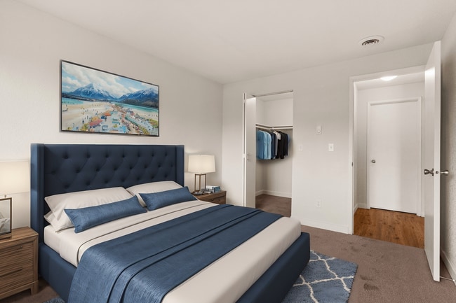 Experience tranquil comfort in this beautifully designed bedroom with ample storage and chic decor. - Monte Vista Apartments