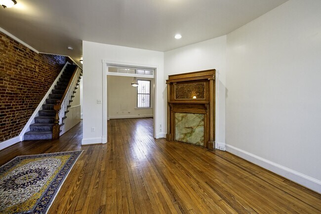 Building Photo - Historic & Charming 3BR Rowhouse near Howard is Move-in Ready!