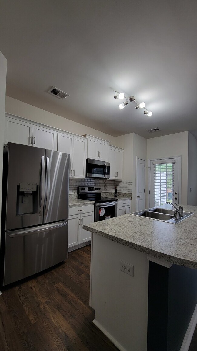 Building Photo - "Modern 3-Bedroom Multiplex with 3 Full Ba...