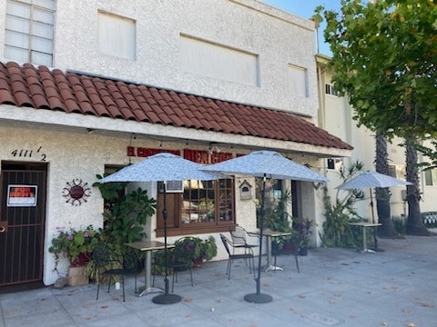 Unit is upstairs over beauty salon and resturant - 4111 W Olive Ave