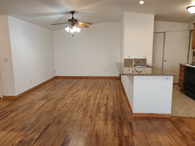 Building Photo - 2x2 duplex with a fenced yard, single-car ...