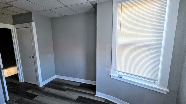 Building Photo - Beautiful Two Bedroom, Plus a Pass Through Room with a Fenced in Rear Patio