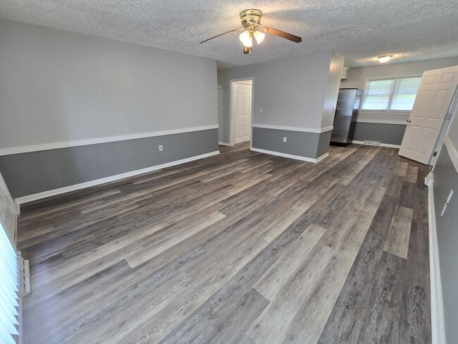 Building Photo - 3/2 with Fenced Yard; In-town and Near an ...