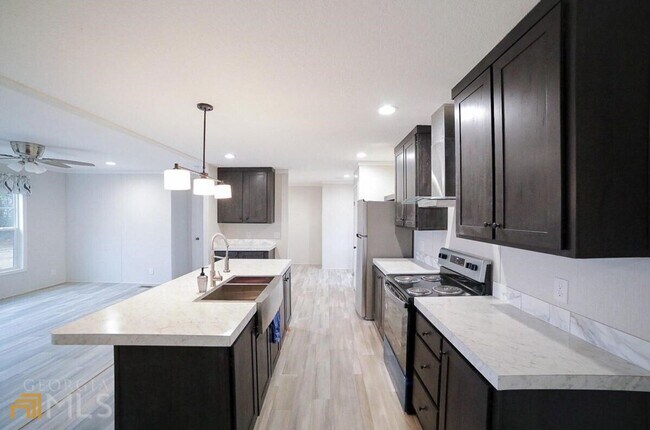 Building Photo - Spacious 4-Bedroom Home with Lawn Maintena...