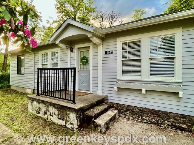 Primary Photo - This 3-bedroom 1-bathroom house has a large front yard and a mostly fenced backyard.