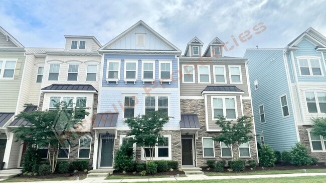 Building Photo - 3 Story Townhome 3 Bedrooms Rear Entry 2 Car Attached Garage with 1st Floor Bedroom, Community Po...