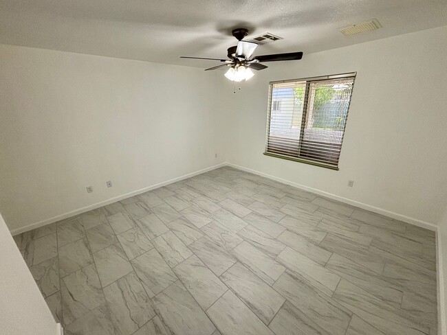Building Photo - This inviting single-story home boasts a s...