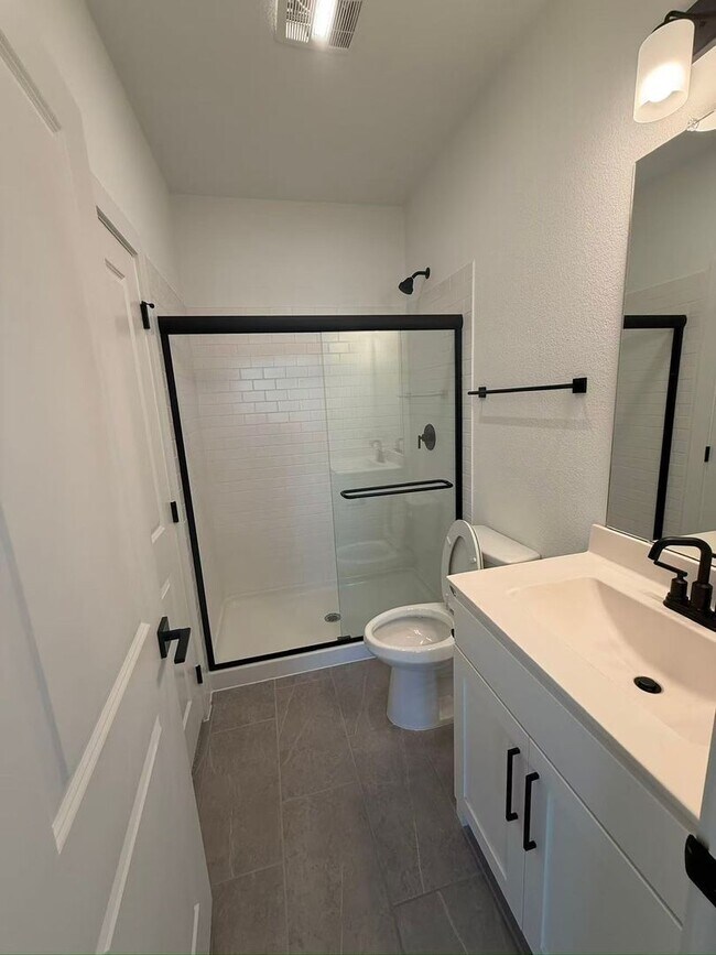 Building Photo - Move-in ready and like-new! Washer, dryer, and refrigerator Included.