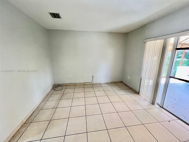 Building Photo - 6975 NW 173rd Dr