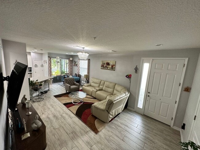 Building Photo - Lease this 3BR End-Unit Townhome in Gated Community with Water View!