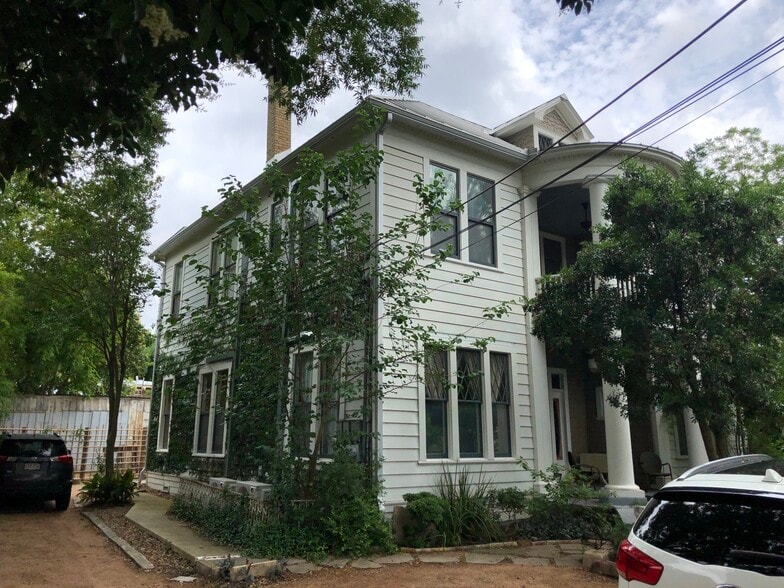 Apt 1 is on the bottom floor front to back of this shot. Walk to the back private entrance - 704 E Guenther St