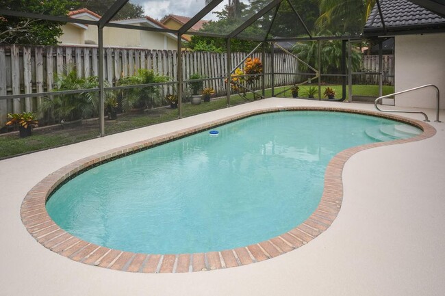 Peaceful pool and backyard - 4355 NW 25th Way