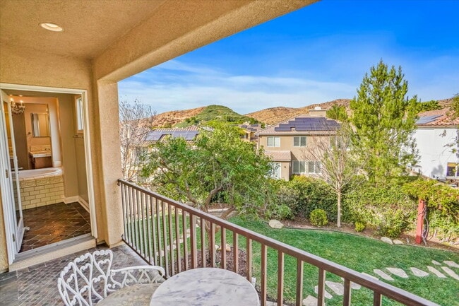 Building Photo - "Spacious 4-Bedroom Retreat with Cozy Fire...