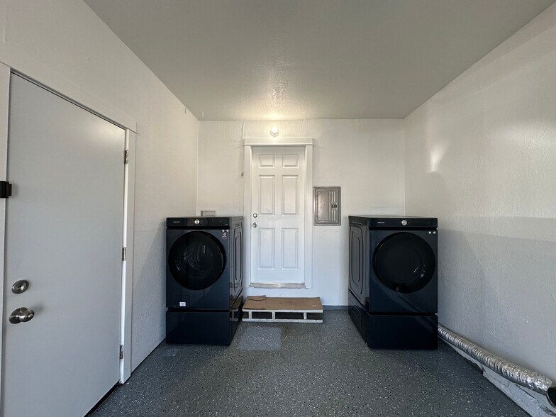 Full sized laundry machine and a one-car garage. - 721 15th St