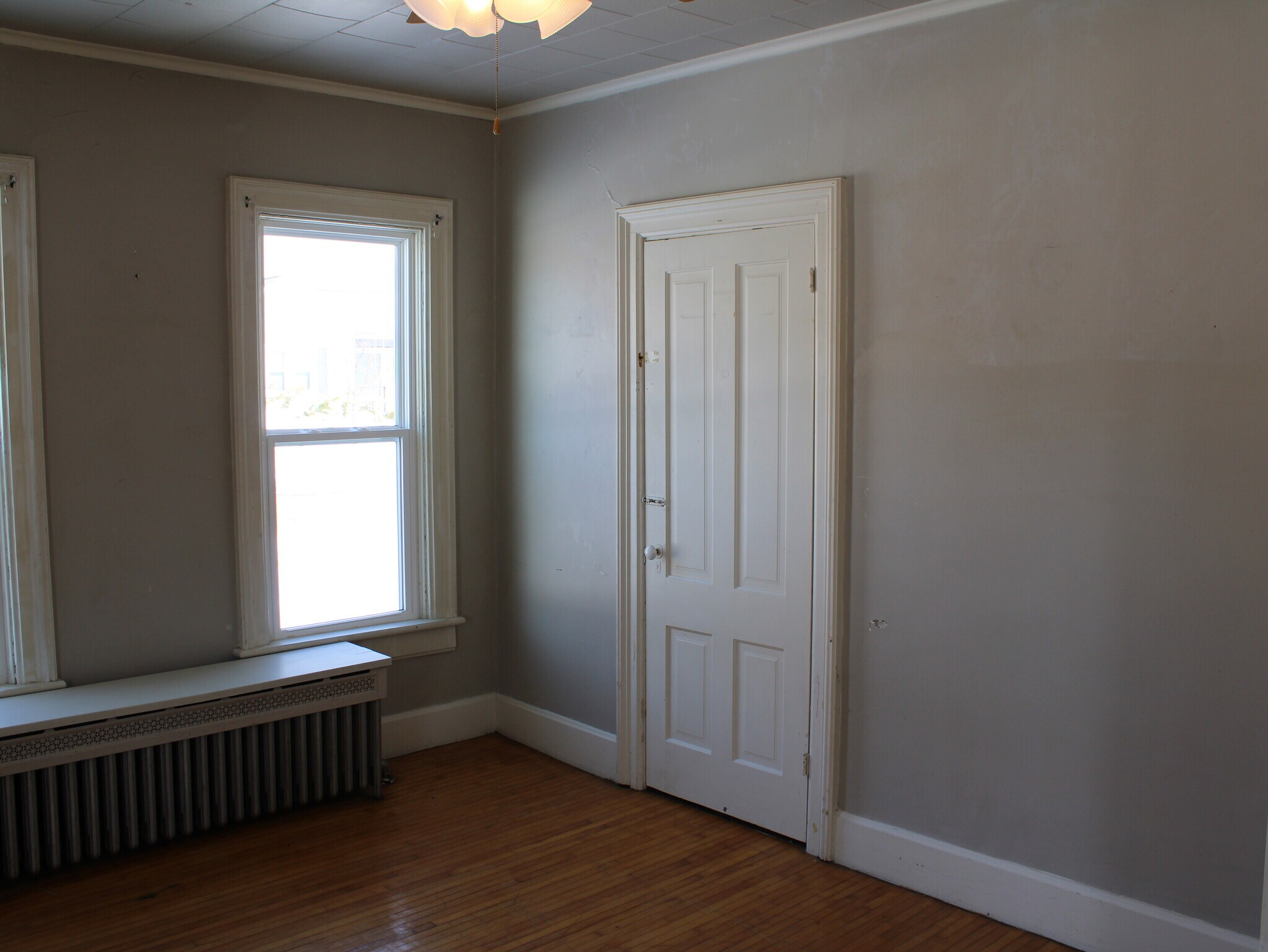 First bedroom with front door access. - 28 5th St