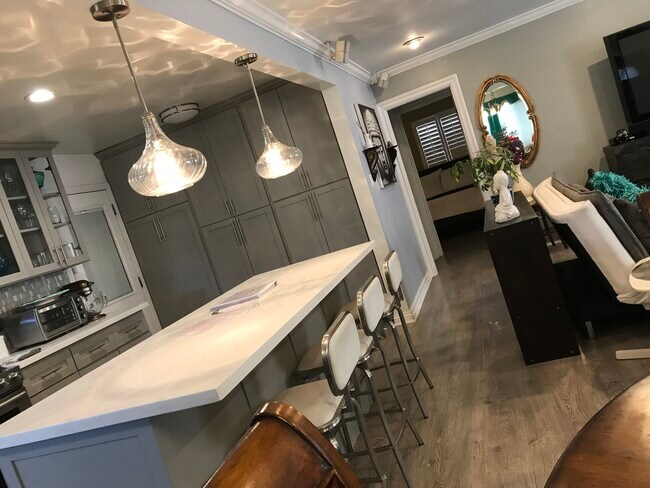 All Marble countertops and island with wine freezer. - 3822 Berryman Ave