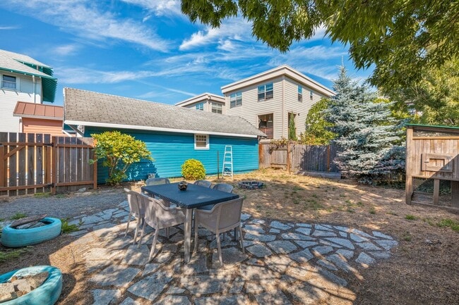 Building Photo - 1/2 Month Free! Storybook Farmhouse - Updated Kitchen, A/C, Basement, Fenced Yard, Garage, Laundr...