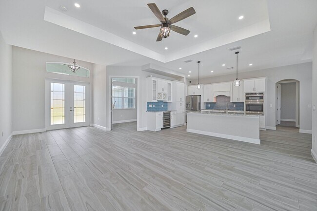 Building Photo - NOW AVAILABLE - Gorgeous Pool Home ~ NW Cape ~ 3 Car Garage ~ On Canal!