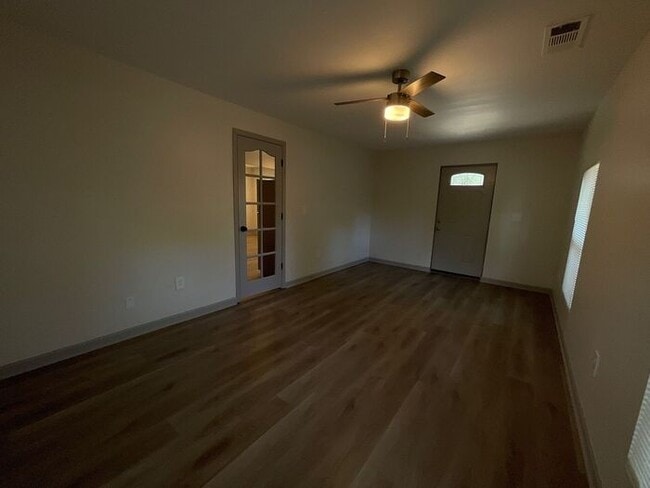 Building Photo - **Spacious 4BR with Modern Upgrades & Cove...