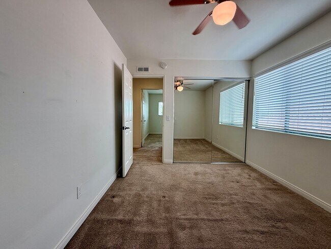 Building Photo - Spacious 4 Bedroom House with Large Fenced Yard! Landscaping Included! Two Car Garage!