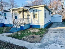 Front of the house with porch, driveway, and garage - 715 Koogler St