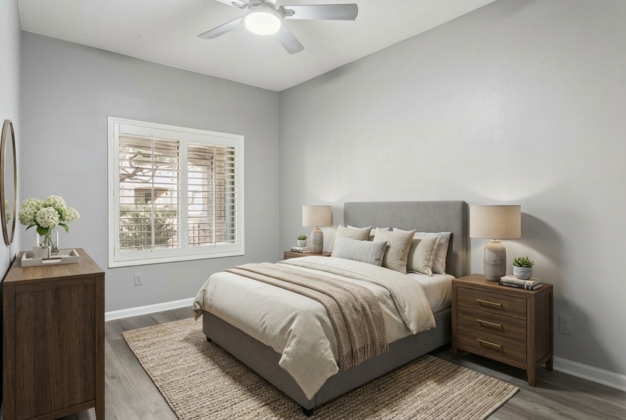 The second bedroom looks out to the covered patio (virtually staged) - 14000 N 94th St