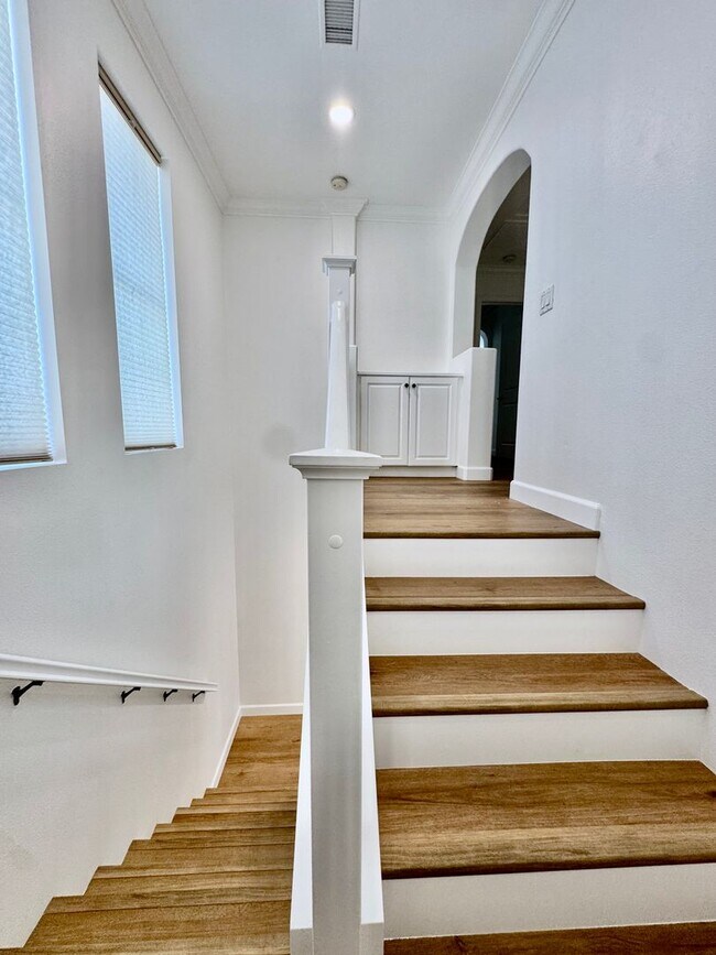 Building Photo - Beautifully Remodel Townhouse with AC & Two Car Garage!