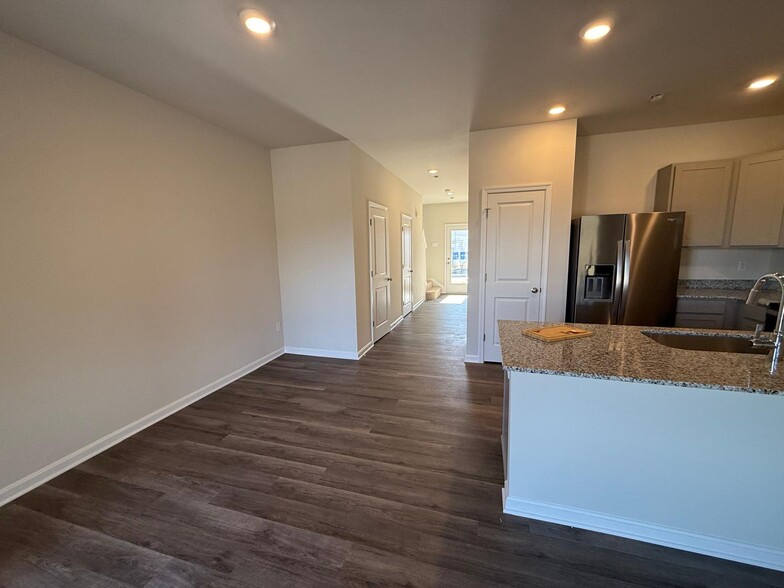 Hallway to back entrance/upstairs - 157 Tigney Dr