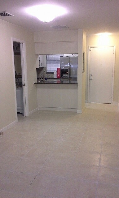 inside back entrance, kitchen & half bathroom to left - 252 Majorca Ave